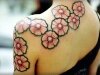 Individual flowers spanning from neck to arm